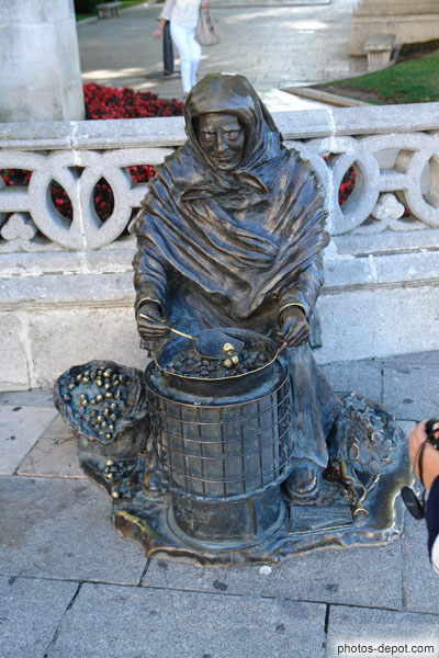 photo de vendeuse de marrons grillés