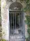 Grille menant à l'une des grottes aux sources d'eau chaudes à 27° / France, Languedoc Roussillon, Gorges de Galamus