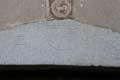 Bandeau en forme de fronton gravé des lettres Alpha et Omega dans un blason entouré des lettres AA / France, Languedoc Roussillon, Arles sur Tech