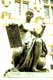 Statue femme nue au compas